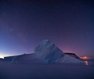 night sky with a view of an iceberg